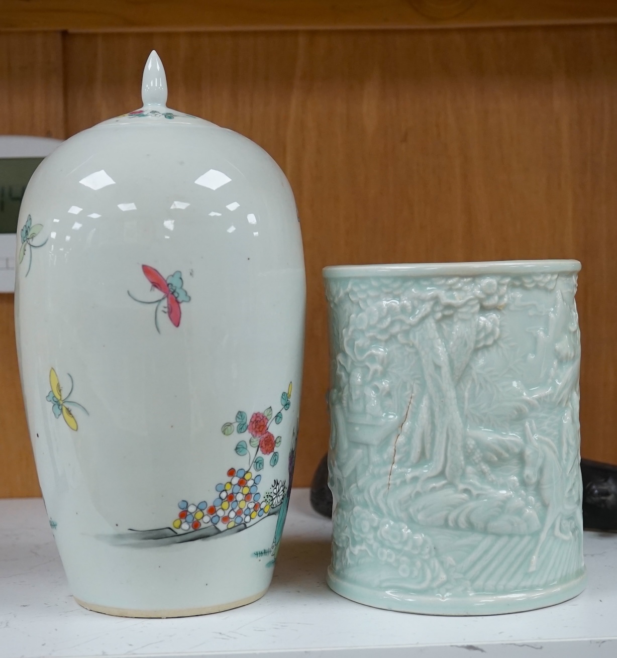 Three Chinese items comprising model of a stringed instrument (Pipa?), a celadon glazed brush pot and famille rose jar and cover, Republic period, 25cm high. Condition- fair to good